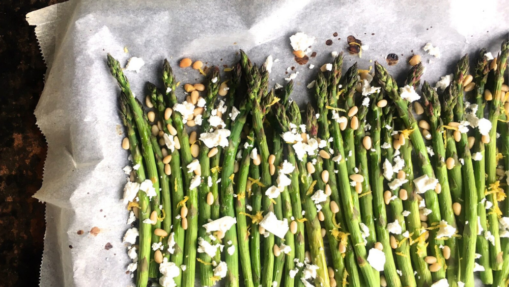 Baked Asparagus with Feta and Pinenuts. The ultimate plus one, this hardworking but easy-to-make side goes with everything. Image: Lyndi Cohen